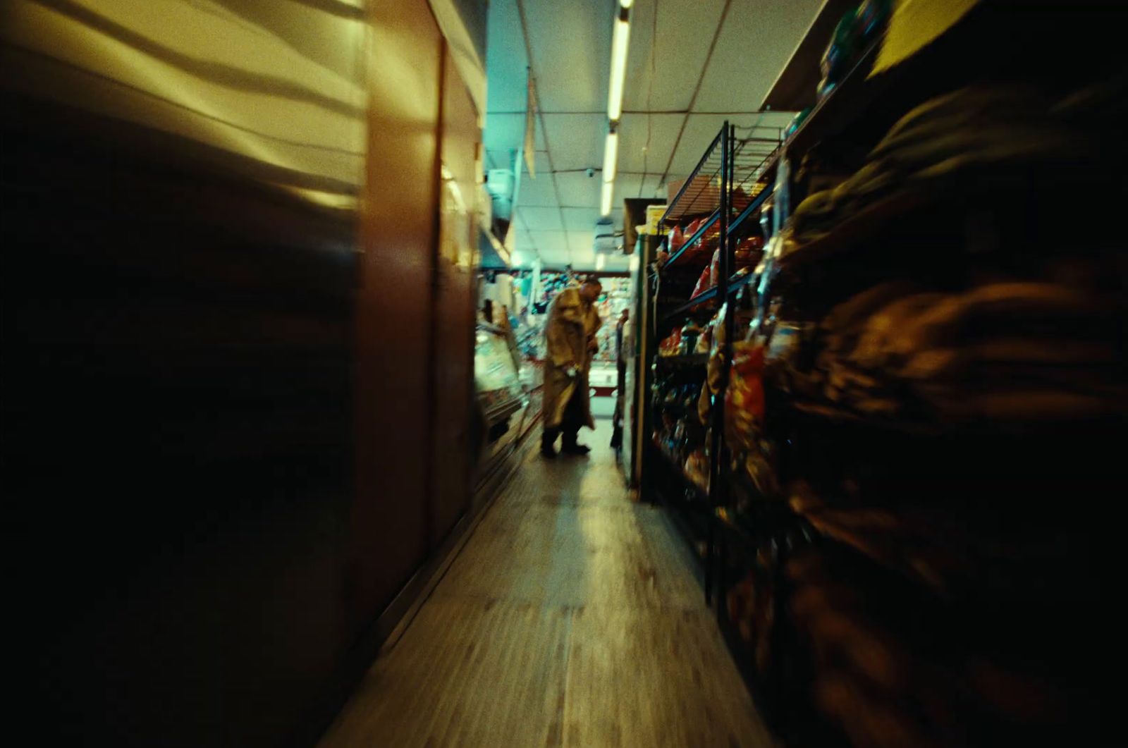 a blurry photo of a person walking down a hallway