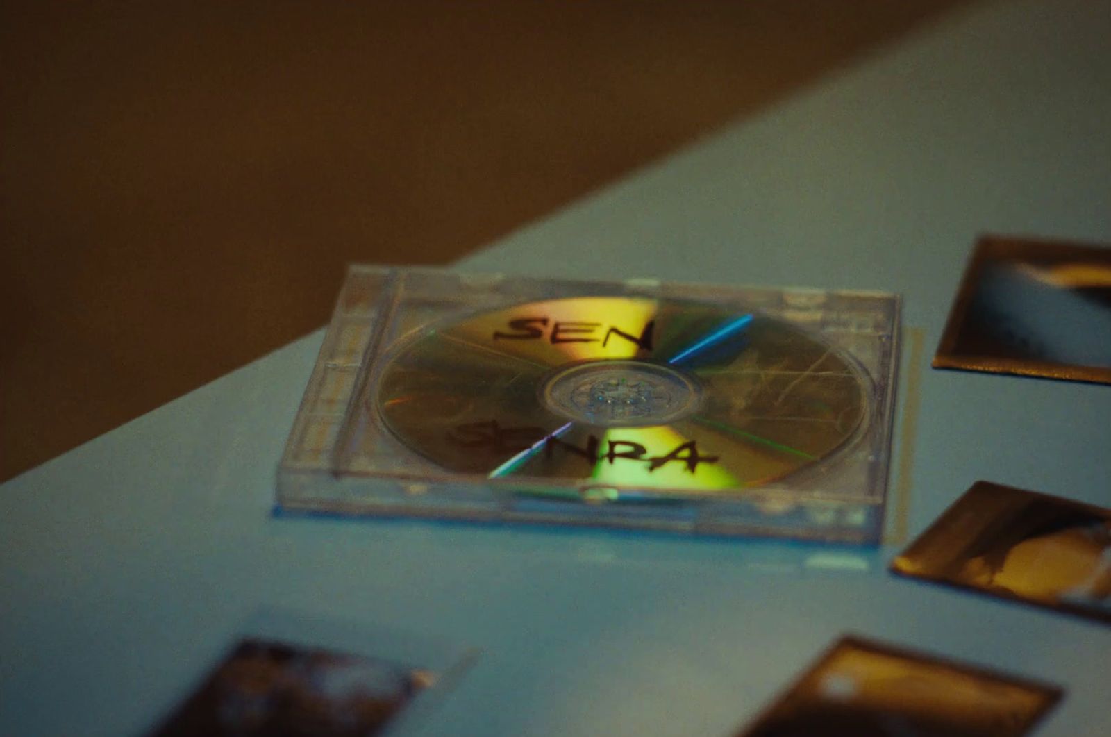 a cd sitting on top of a blue table