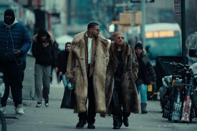 a group of people walking down a street