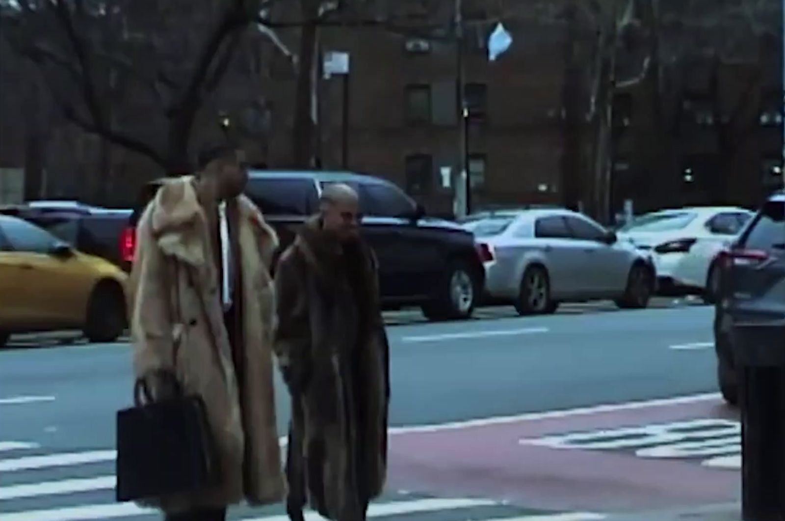 a man and a woman walking down a street