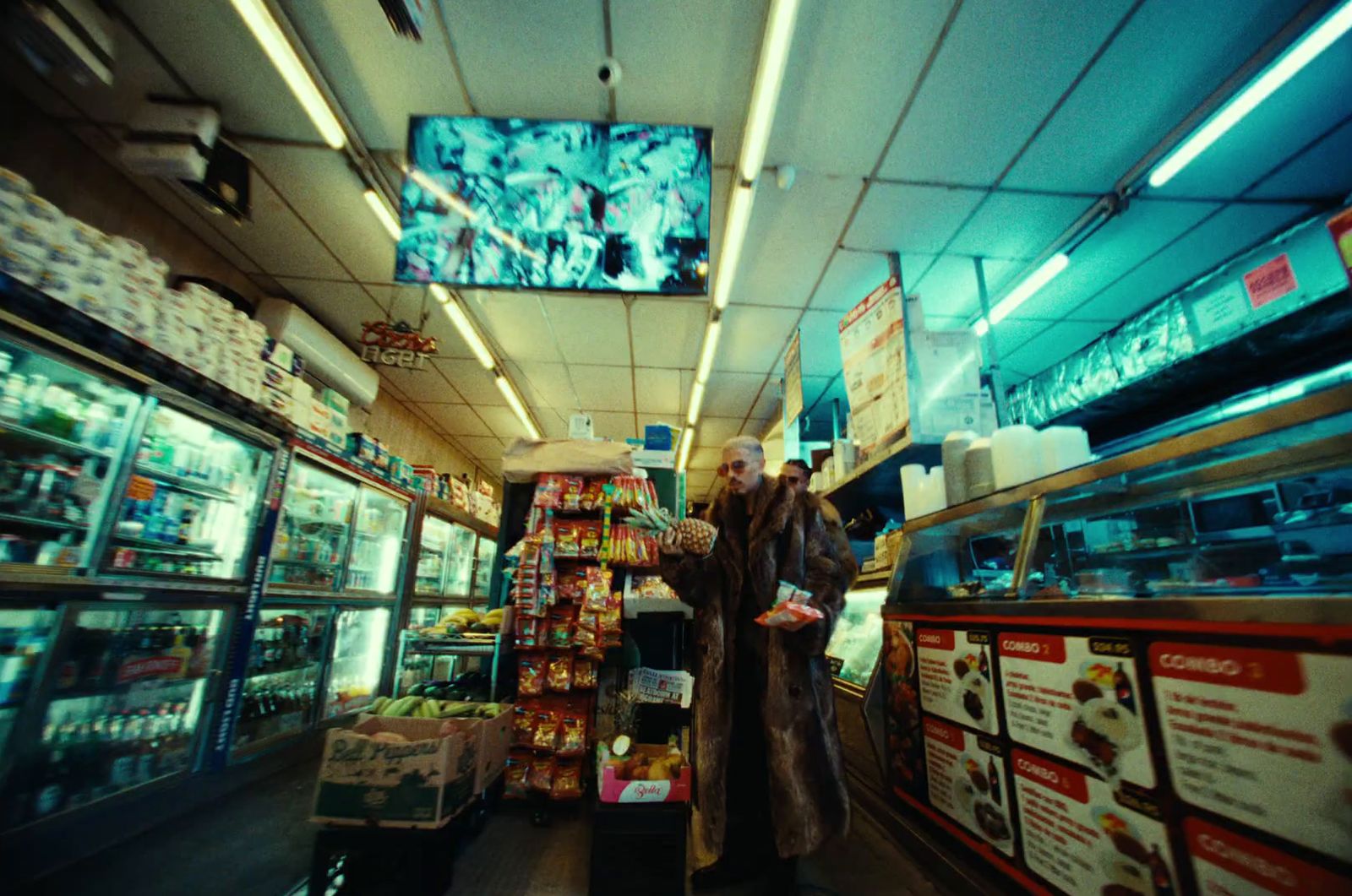 two people standing in a store looking at items