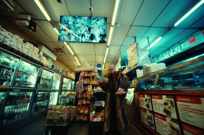 a couple of people standing in a store