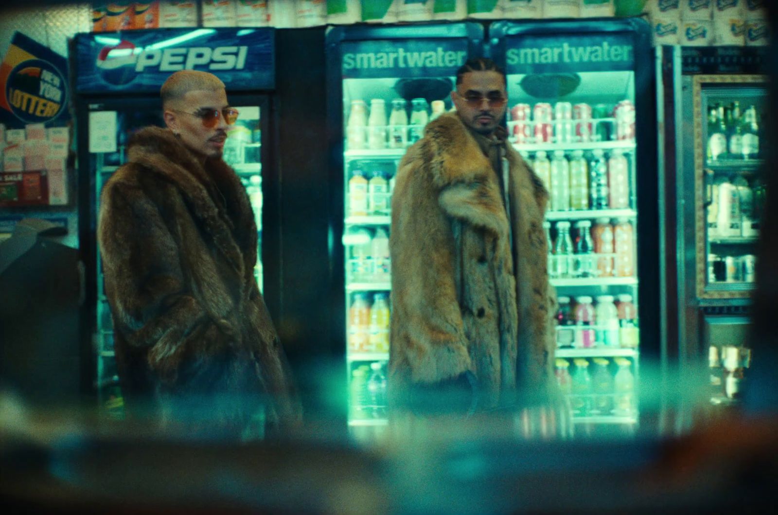 two men standing in front of a vending machine