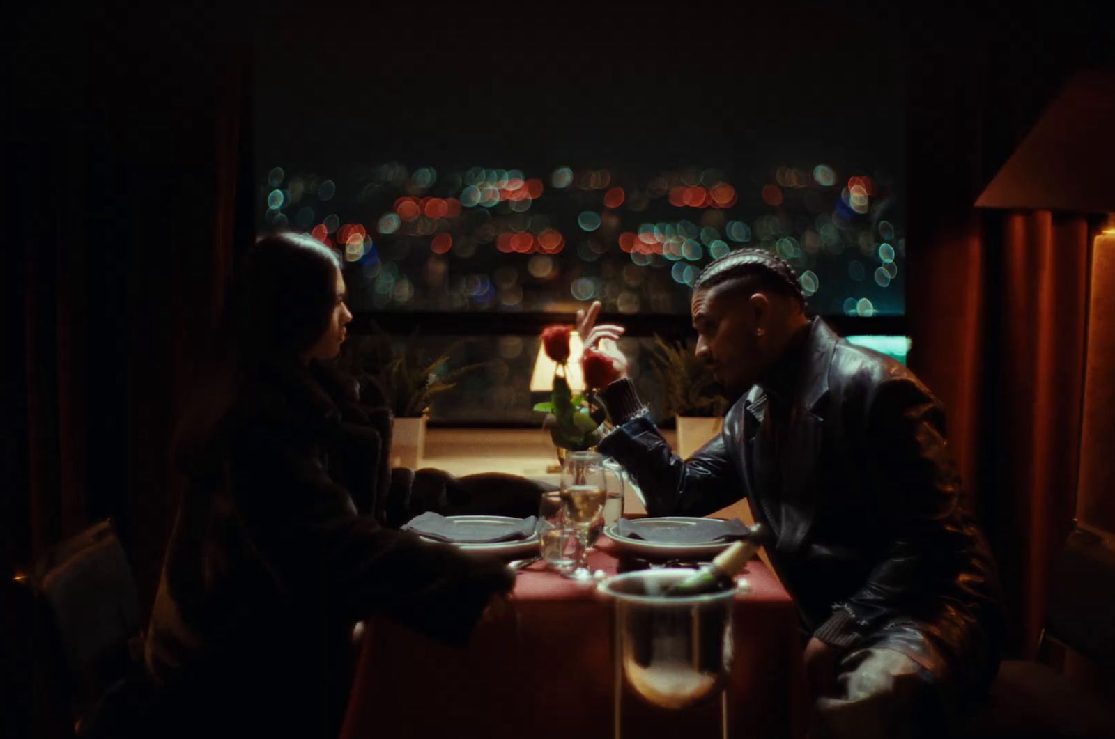 a man and a woman sitting at a table in a restaurant