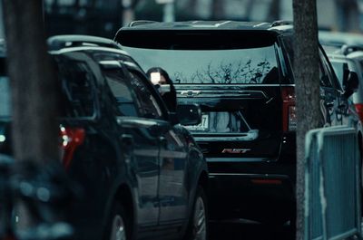 a row of parked cars on a city street