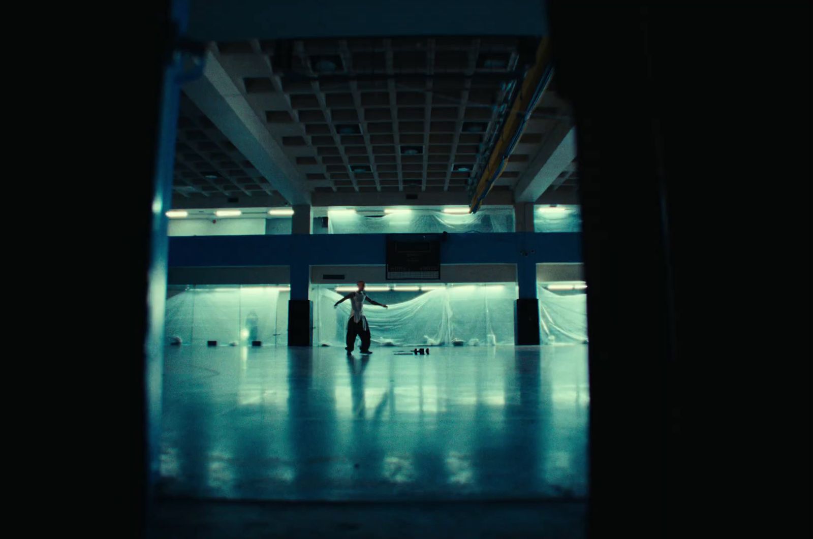 a person standing in a room with a ceiling