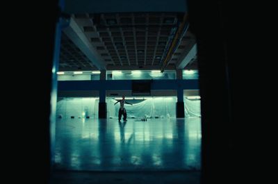 a person standing in a room with a ceiling