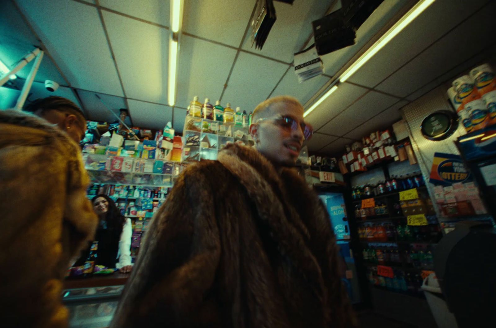 a man in a fur coat standing in a store