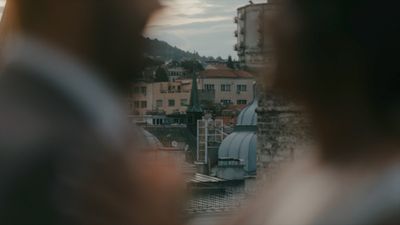 a blurry photo of a person looking out a window