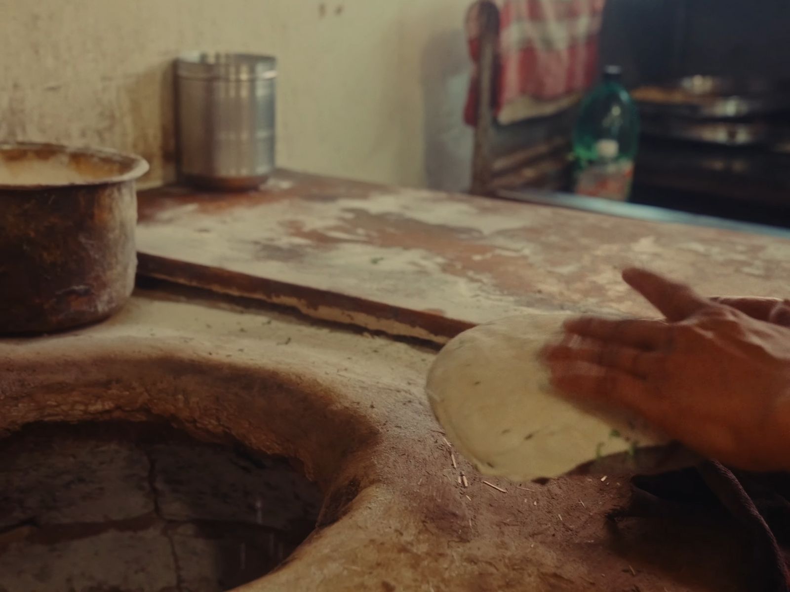 a person holding a piece of paper near a sink