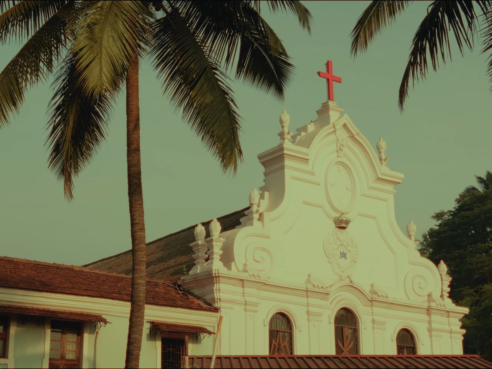 a church with a red cross on top of it