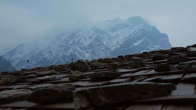 a mountain range covered in snow and rocks