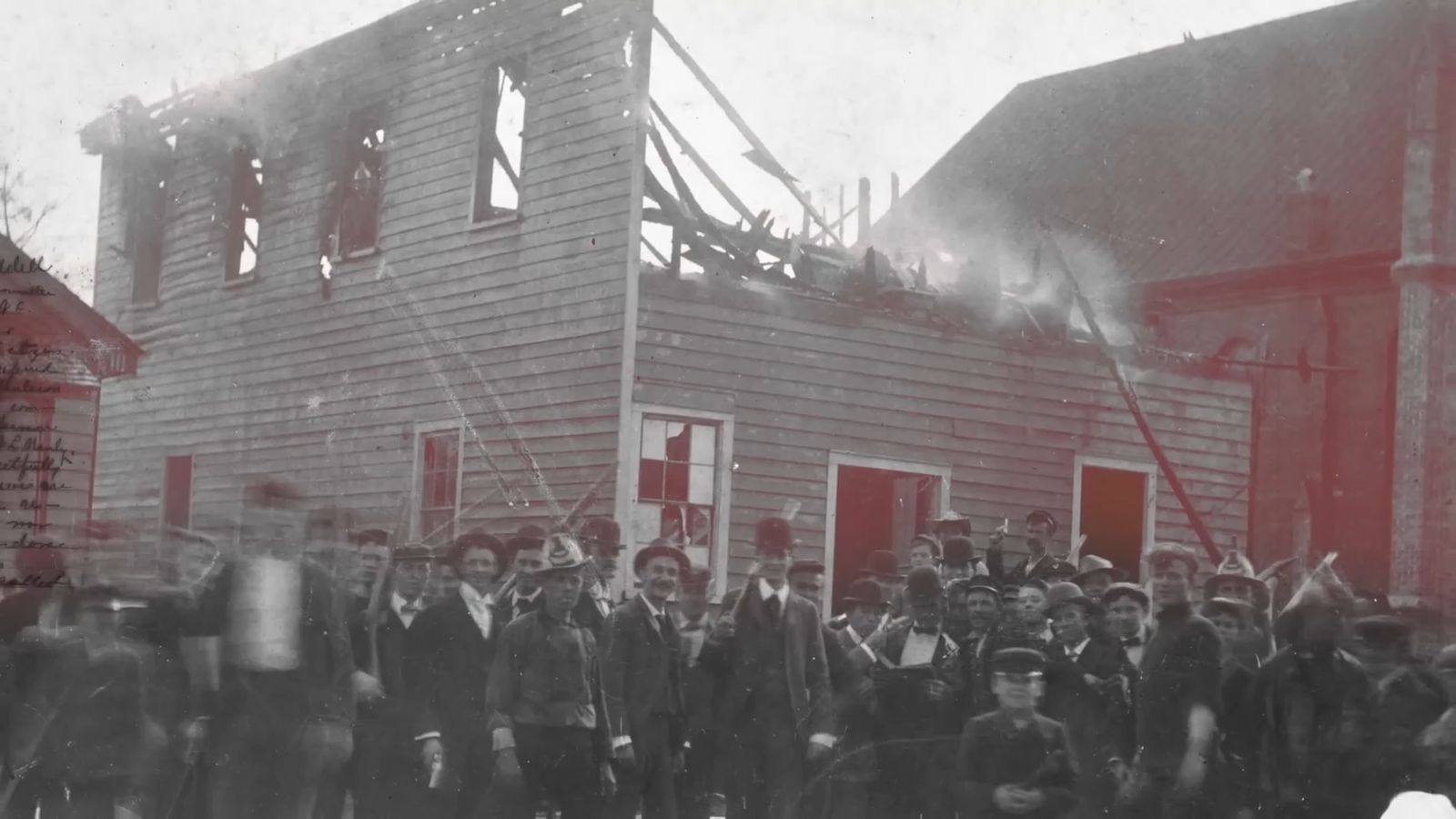 a group of people standing in front of a building