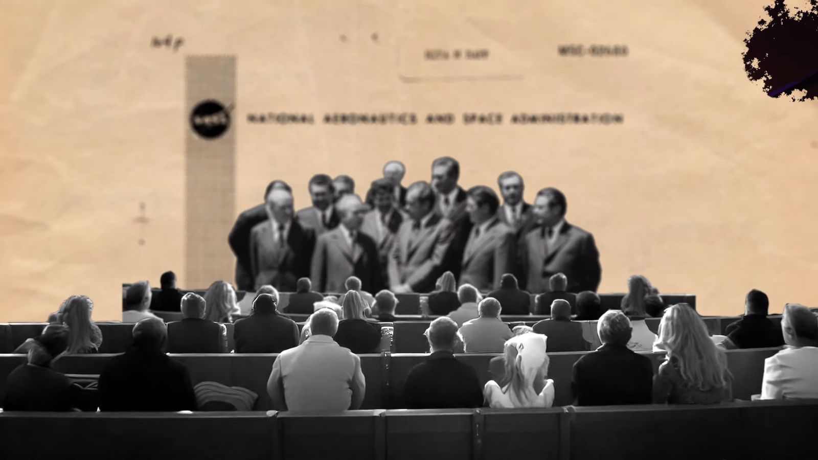 a group of people sitting in front of a building