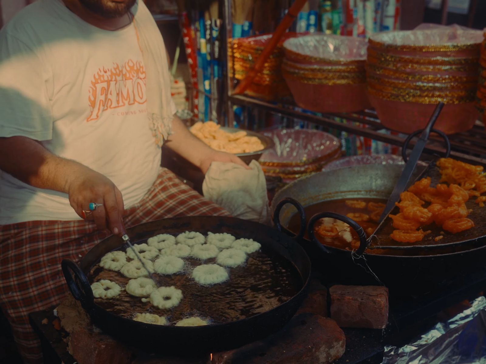 a man standing in front of a table filled with food