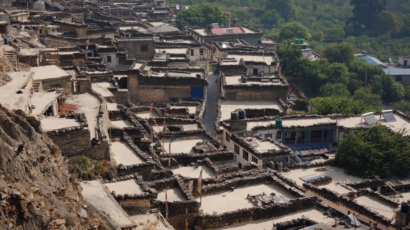 a view of a village from the top of a hill