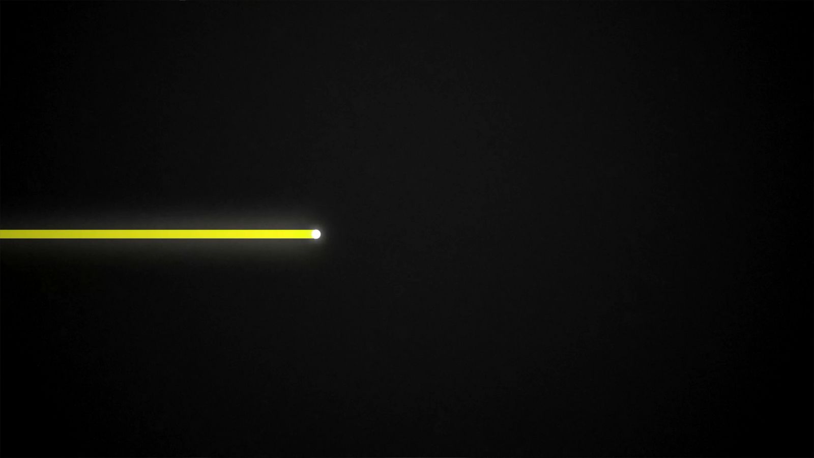 a black background with a yellow light in the middle