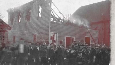 a group of people standing in front of a building