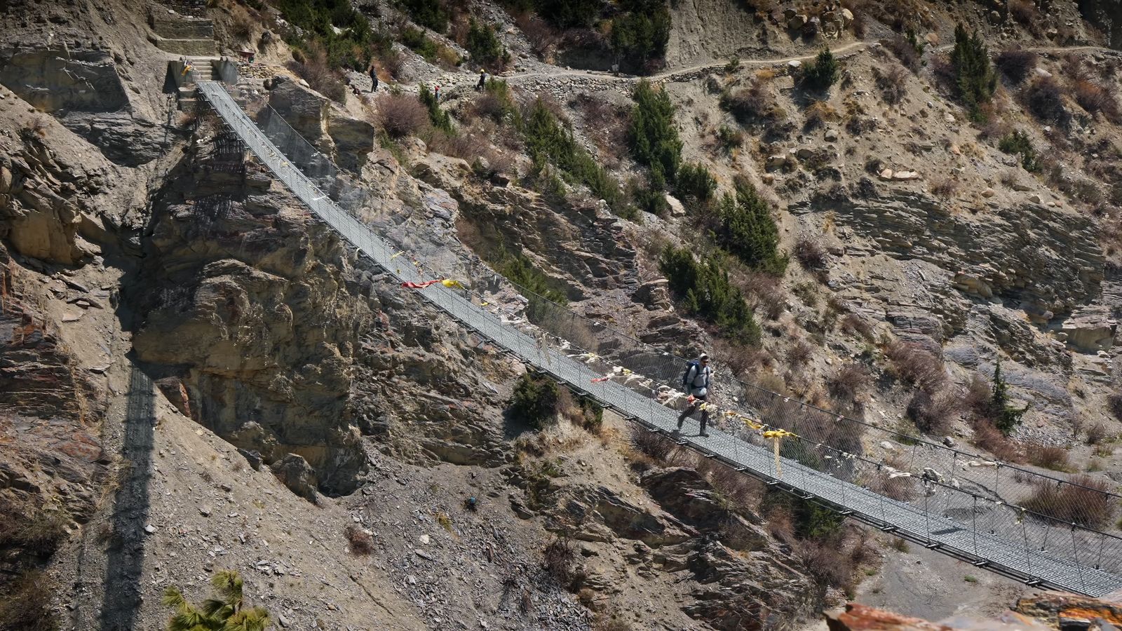 a group of people riding bikes on a bridge