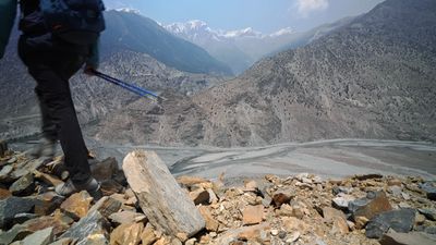 a person standing on top of a pile of rocks