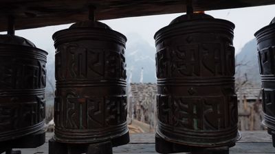 a group of metal bells sitting next to each other