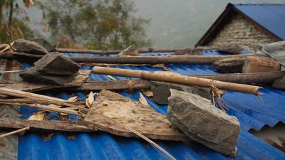 a pile of rubble sitting on top of a blue roof