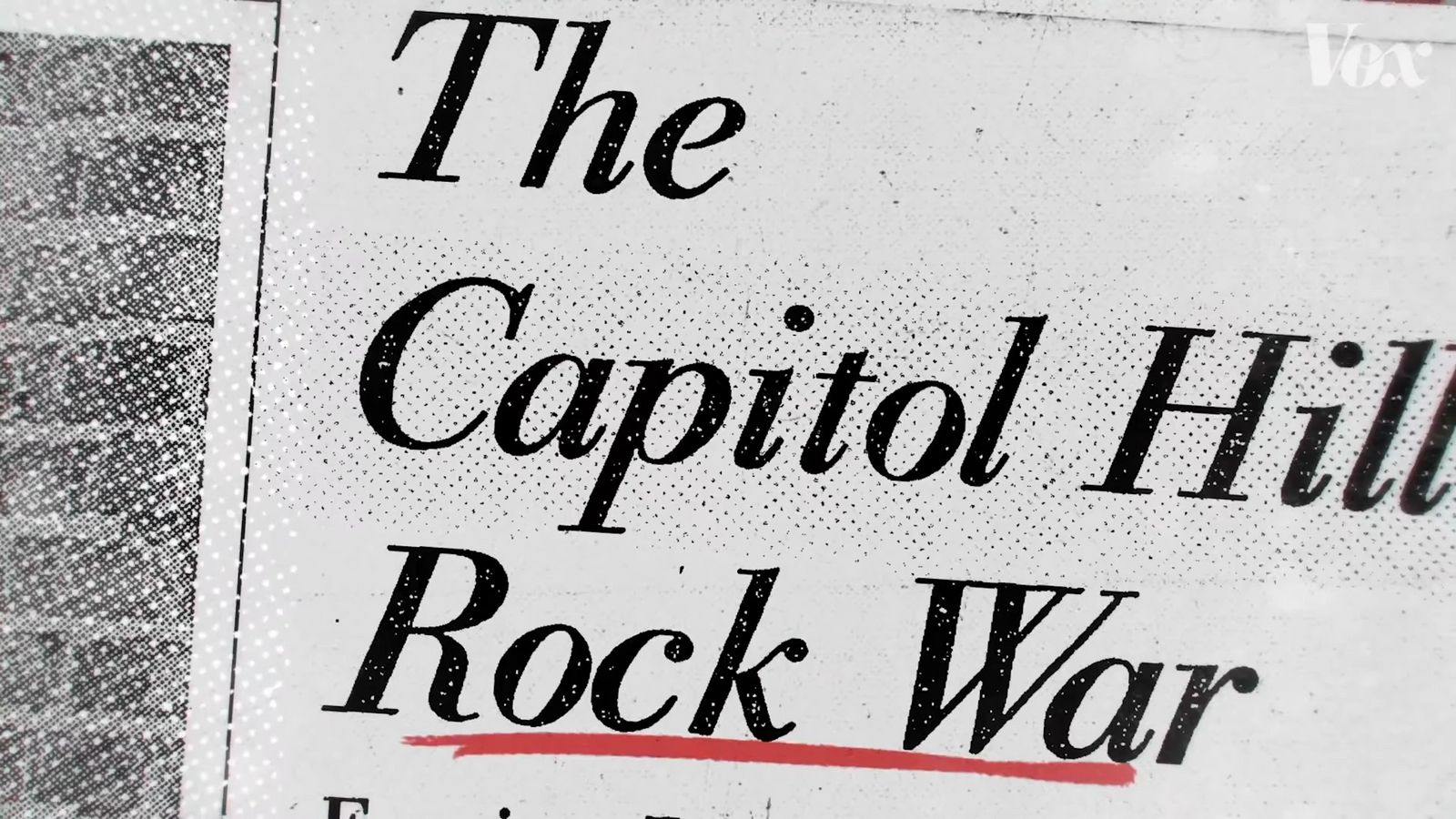 the capitol hill rock war sign in front of a building