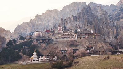 a mountain with a village on top of it