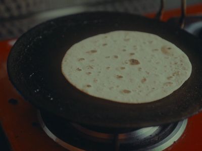 a tortilla sitting on top of a stove top