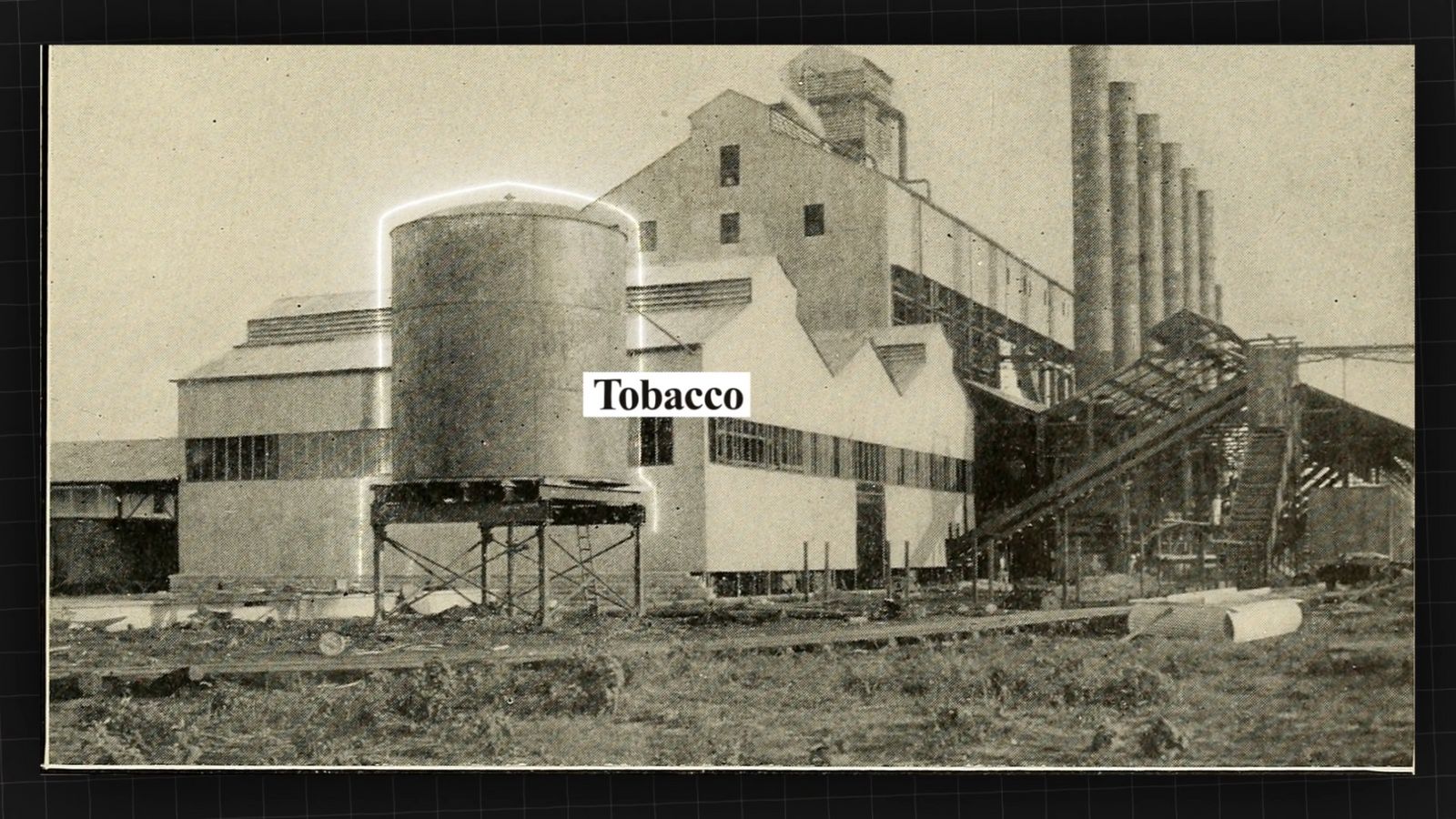 a black and white photo of a factory