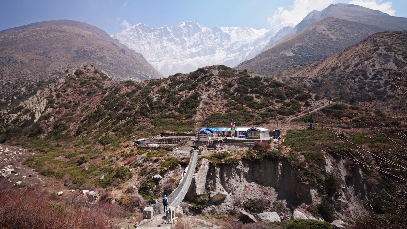 a view of a mountain range with a bridge going over it