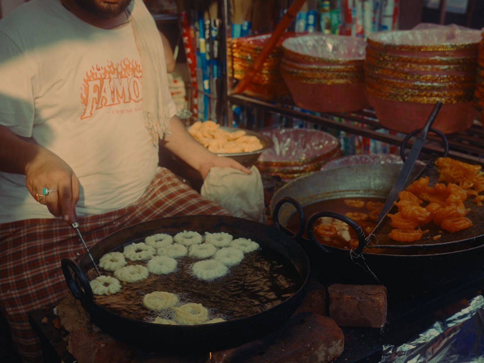 a man standing in front of a table filled with food