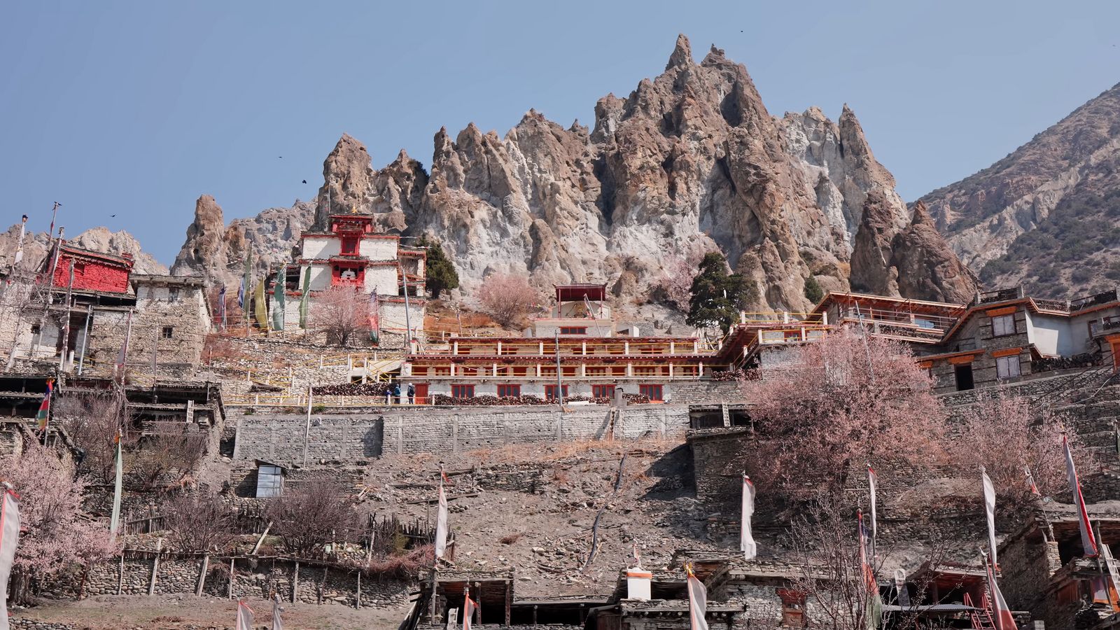 a group of buildings sitting on top of a mountain