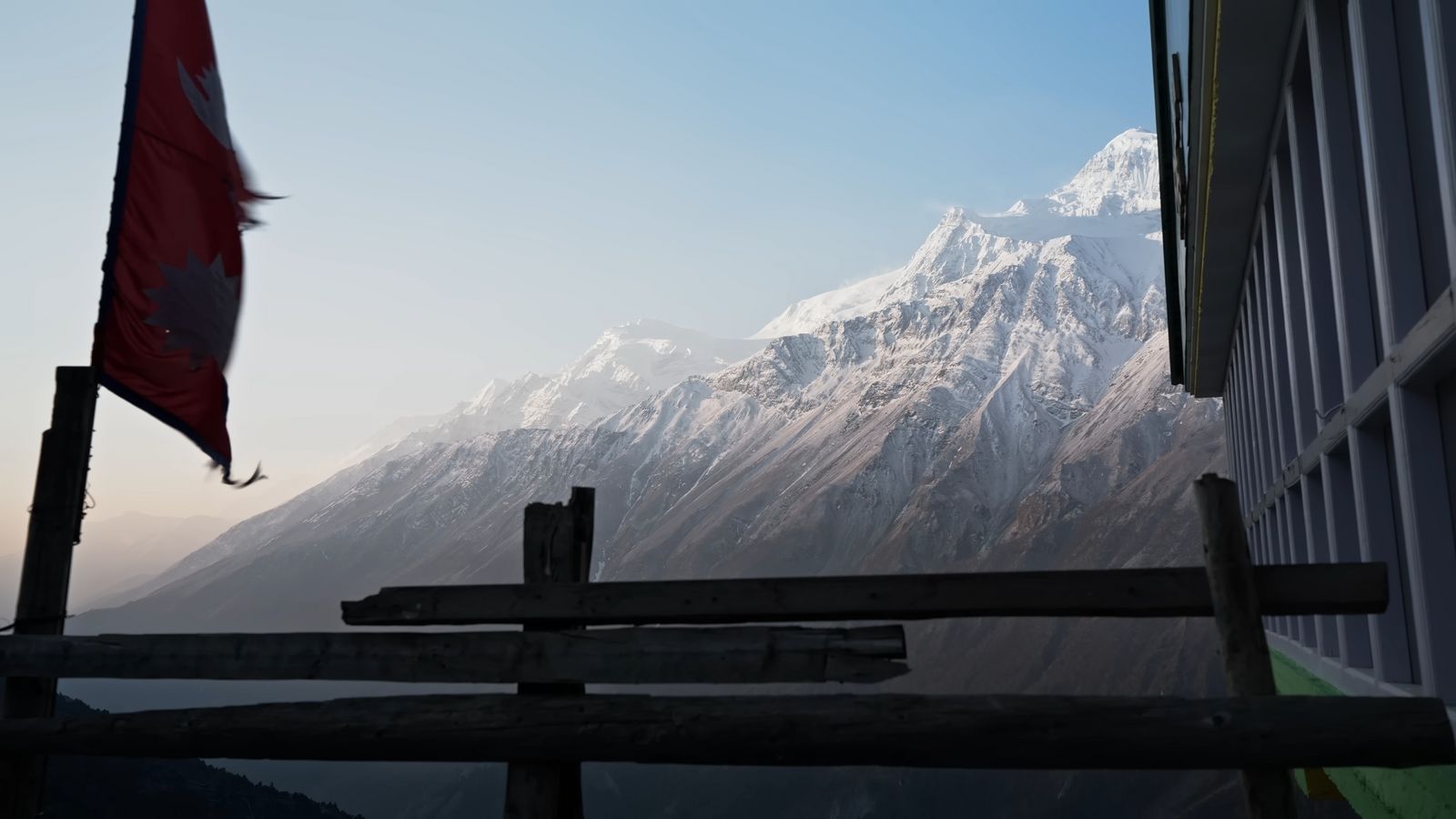 a view of a snow covered mountain from a building