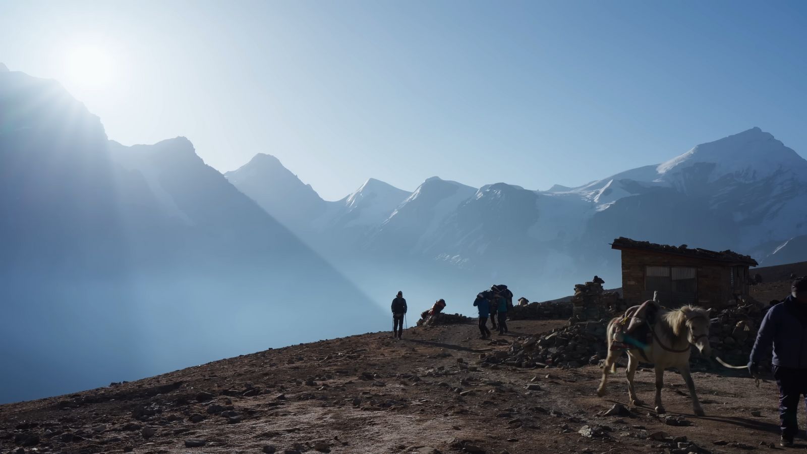 a group of people standing on top of a mountain