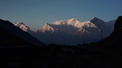 a view of a mountain range from a distance