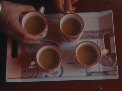 a tray with three cups of coffee on it