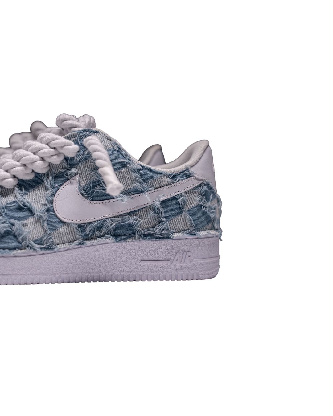 a pair of sneakers with a blue and white pattern