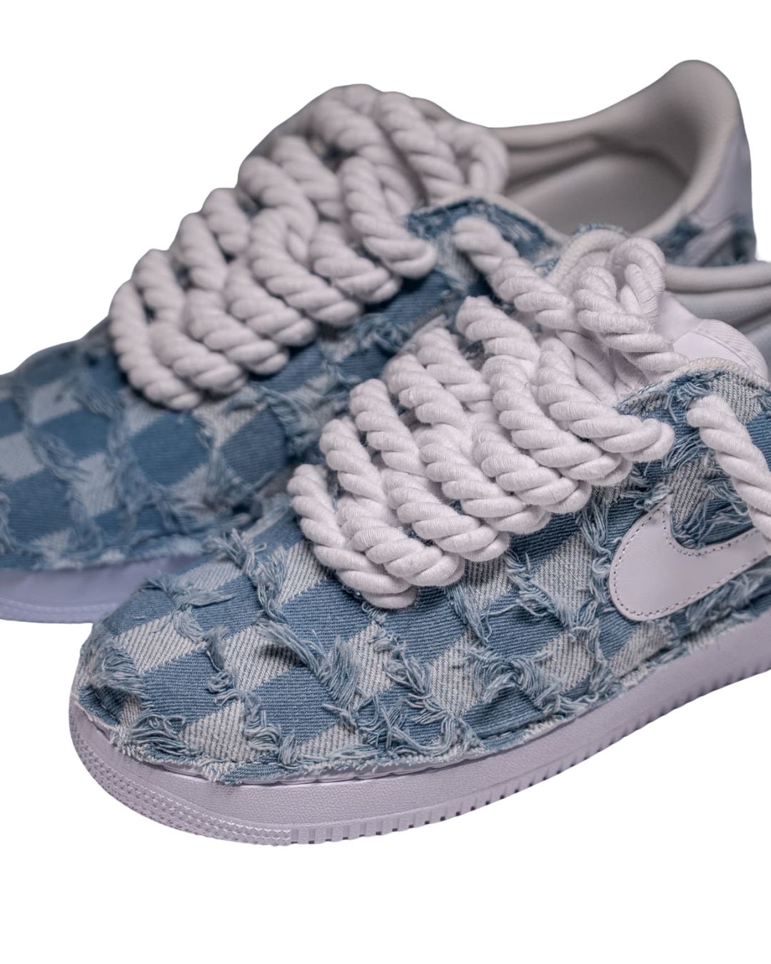 a pair of blue sneakers with white laces