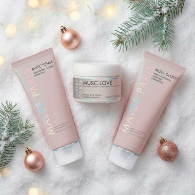 a couple of bottles of makeup sitting on top of a snow covered ground