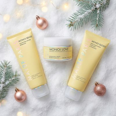 a couple of bottles of lotion sitting on top of a snow covered ground