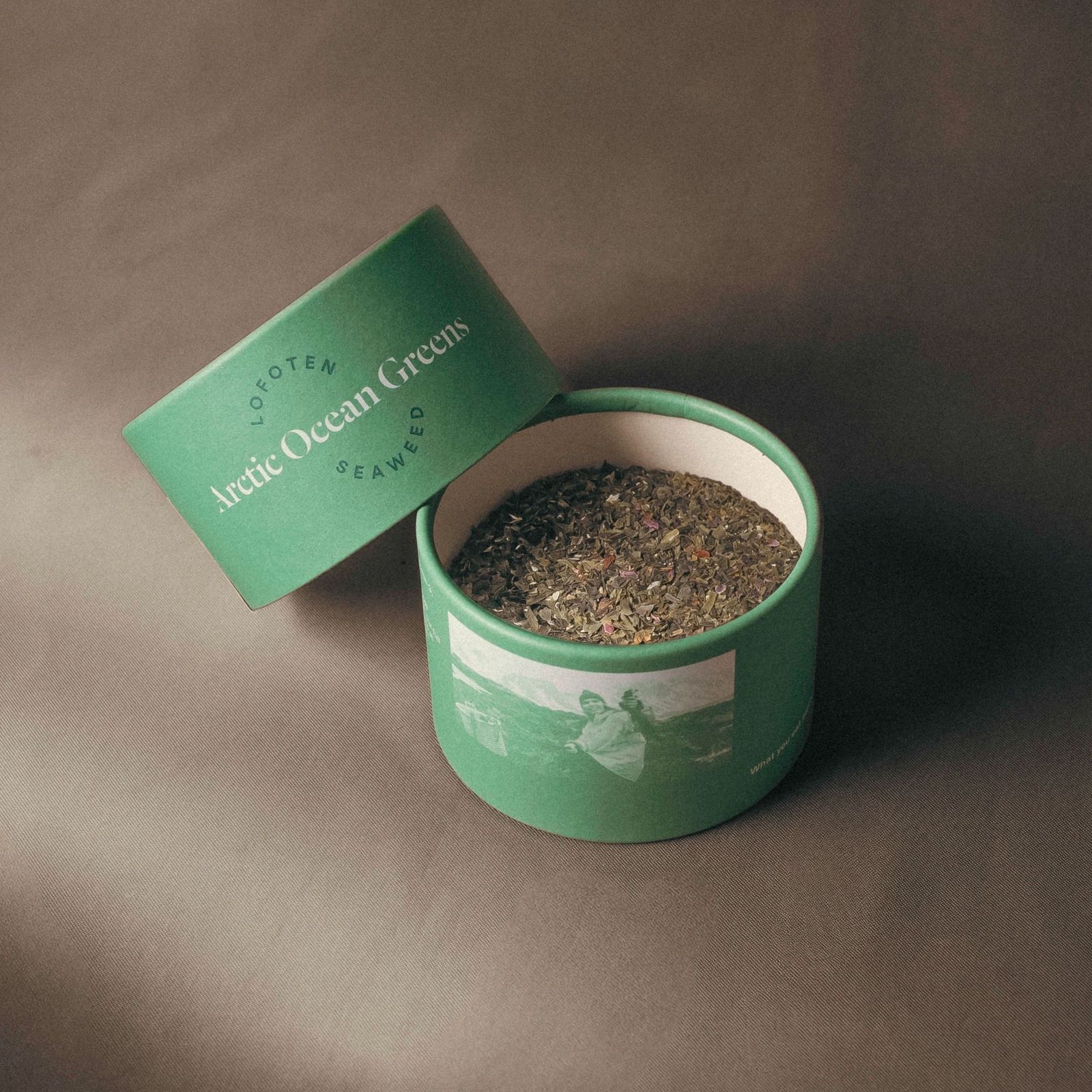 a green container filled with lots of brown stuff