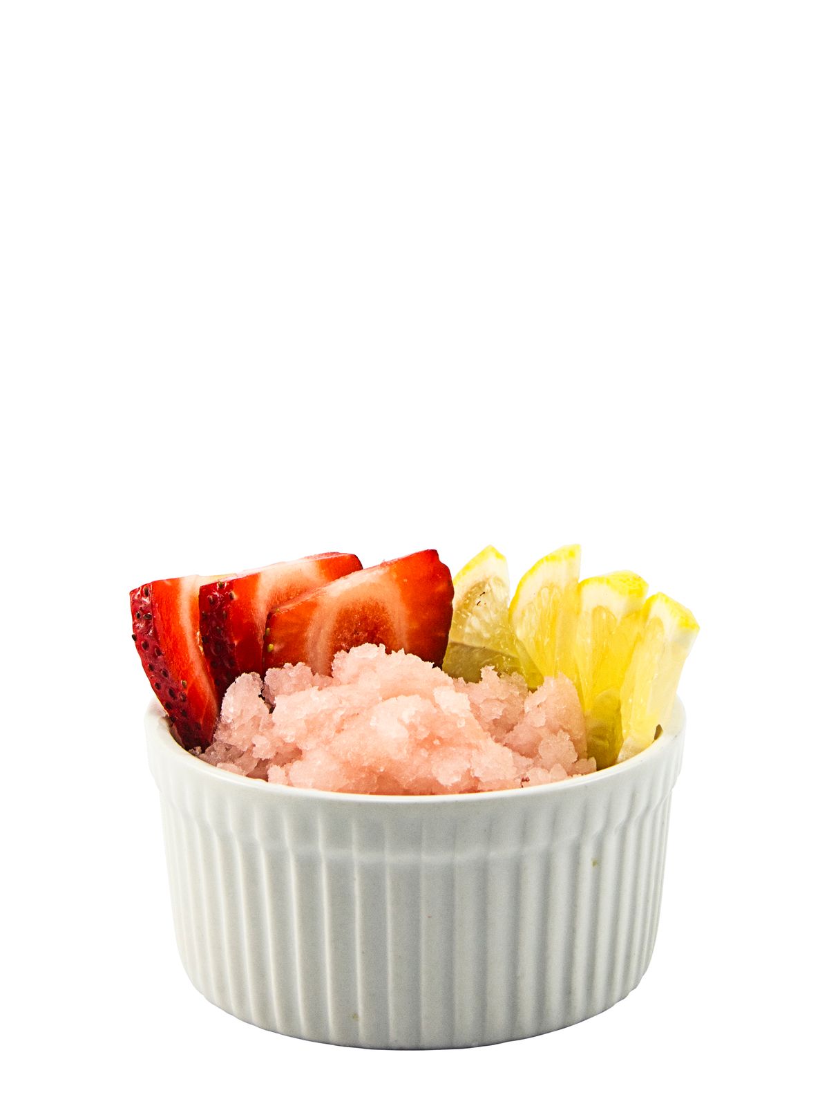 a bowl filled with rice and fruit on top of a white table