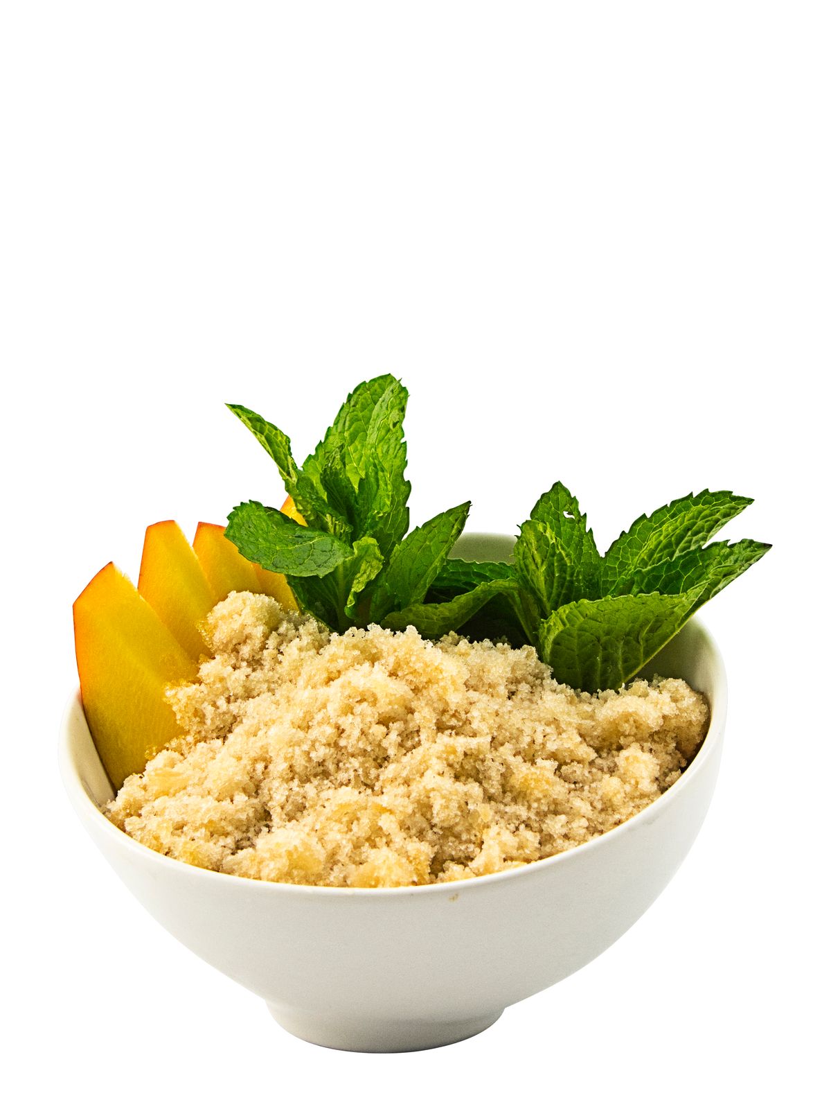 a bowl of oatmeal with mint and peach slices