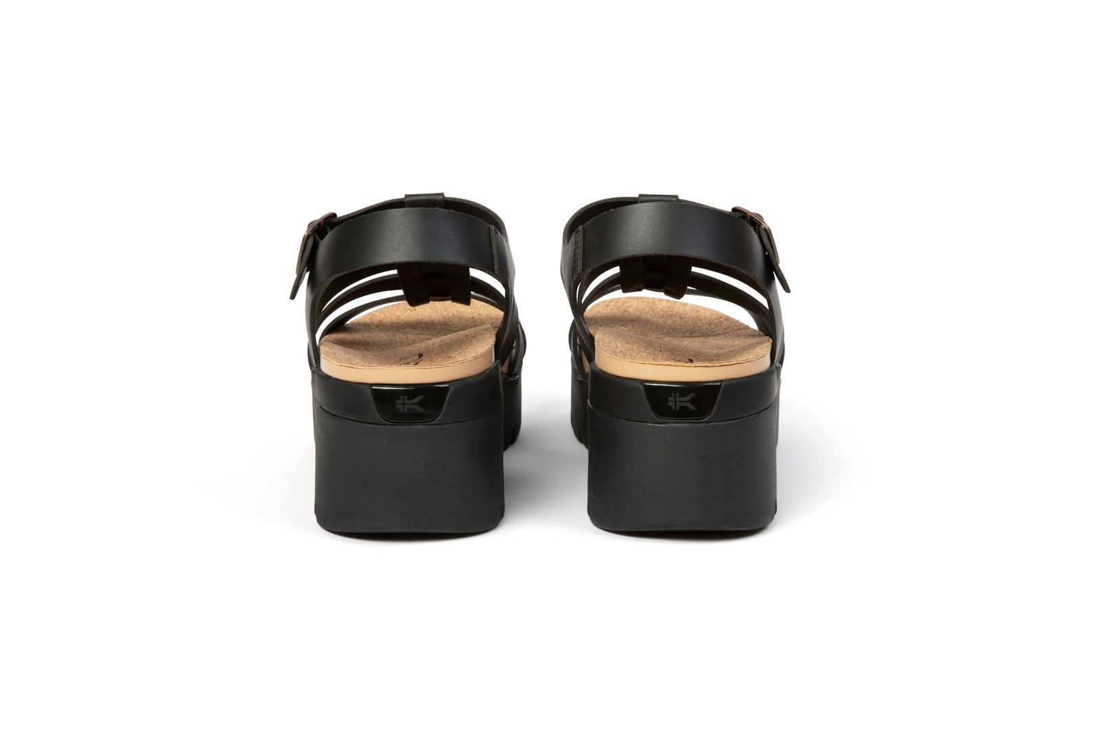 a pair of black sandals on a white background