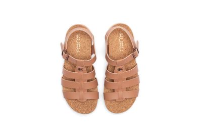 a pair of brown sandals on a white background