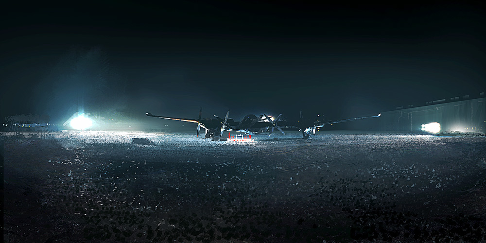 a plane sitting on a runway at night