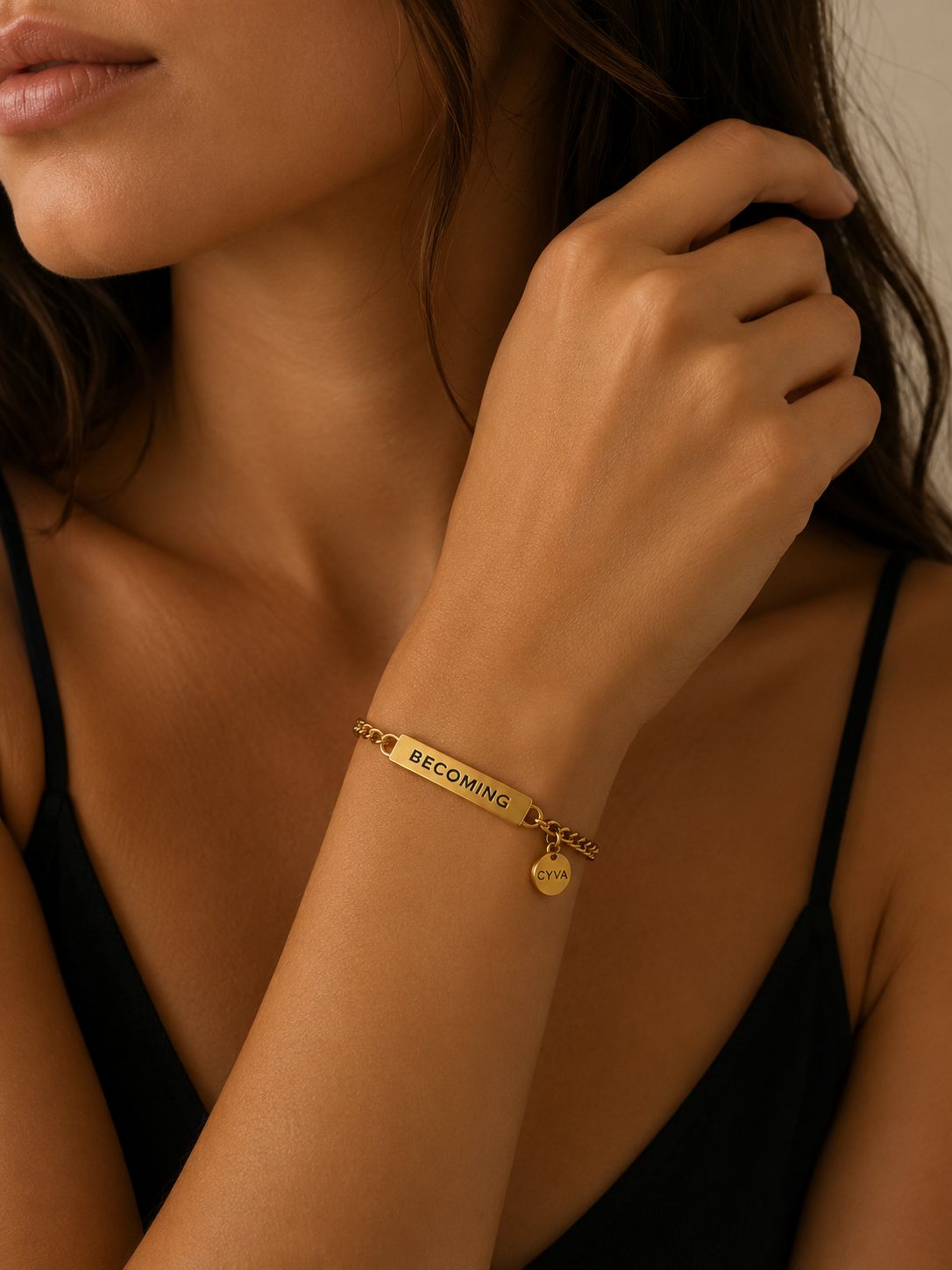 a close up of a woman wearing a gold bracelet
