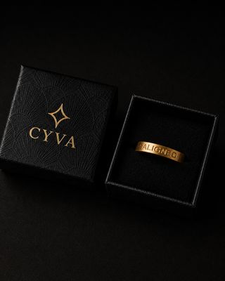 a black box with a gold logo on it