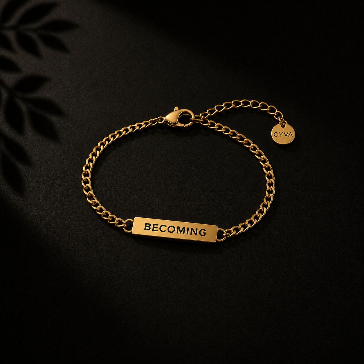 a gold bracelet with the words becoming engraved on it